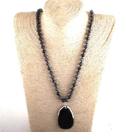 Lava bead necklace with stone pendant