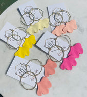Gold circle earrings with colorful ginkgo leaves