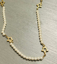 Gold and pearl necklace with toggle clasp