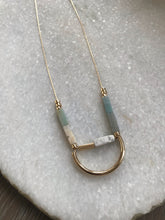 Stone and curved gold necklace