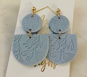 Imprinted flower tiered clay earrings