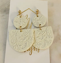 Imprinted flower tiered clay earrings