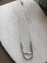 Stone and curved gold necklace