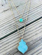 Double layered necklace with green pendants