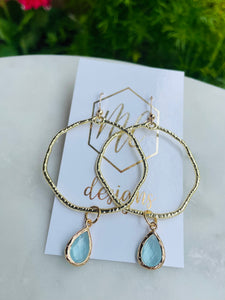 Gold circle earrings with colorful teardrops