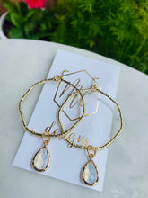 Gold circle earrings with colorful teardrops