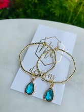 Gold circle earrings with colorful teardrops