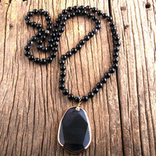 Lava bead necklace with stone pendant